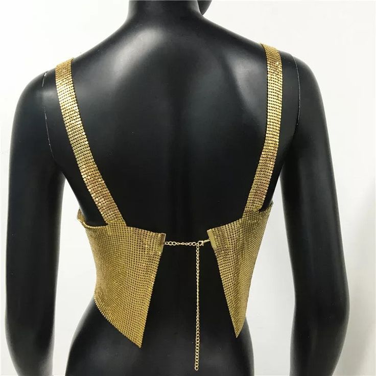 Metal halter top. SIZE Bust: 30”-38 Length: 6,69” Backless Party Top With Straps, Chic Party Tops With Straps, Party Top With Straps And Stretch Fit, Party Tops With Straps And Stretch Fit, Stretch Tank Crop Top For Party, Gold Fitted Cami Top, Summer Gold Tops For Club, Gold Tops For Club Summer Wear, Chic Tank Straps Crop Top For Party