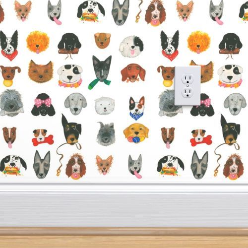 an electrical outlet cover with dogs and cats on it's side in front of a white wall