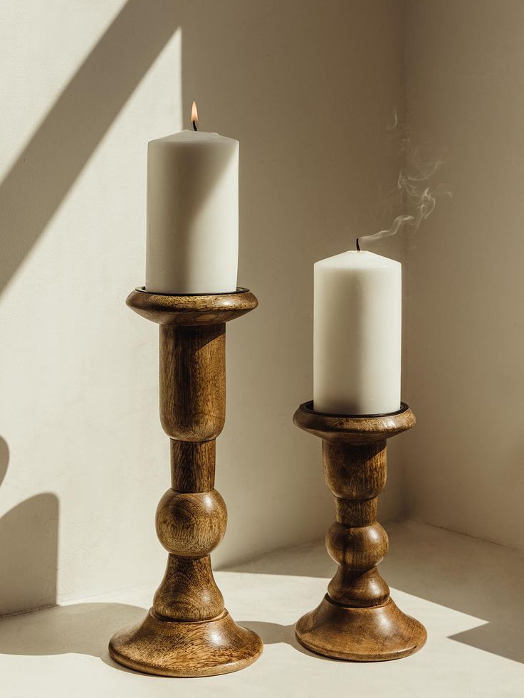 Wooden candle holders; one large and one small. Holder hold white candle on a white table. 6" Pillar Candle Holder, Post Candle Holders, Wood Candle Stick Centerpiece, 3 Books Riser For A Candle, Wooden Candle Stands, Candle Holders Decor Ideas, The Exploited, Pillar Candle Stand, Wooden Candle Stand