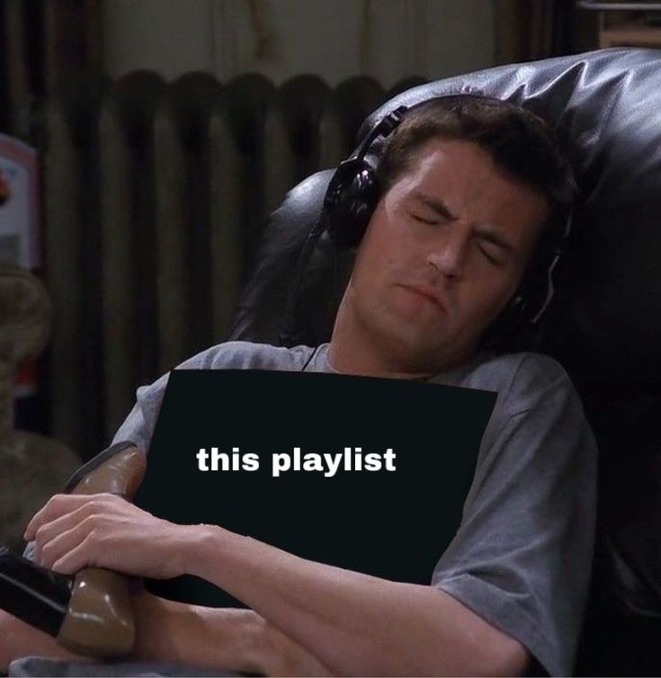 a man laying in a chair with his head resting on a pillow that says, this playlist