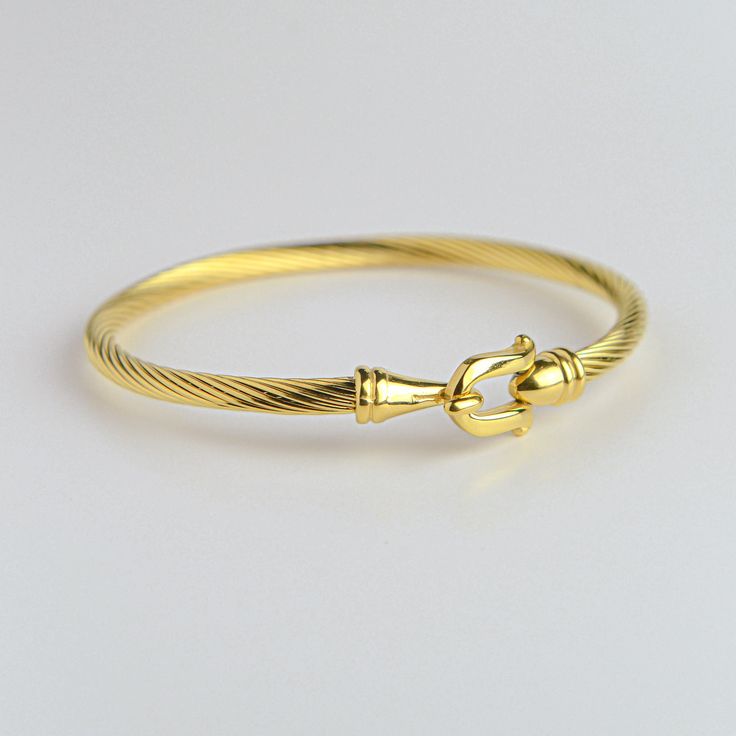 Add some edge to your style with our stunning Lock Bracelet. Made with high quality materials, this bracelet is both trendy and durable. The sleek design is perfect for dressing up any outfit, from casual to formal. Perfect as a gift for yourself or a loved one. Chic Tarnish-resistant Bangle Bracelets, Trendy Gold Bangle Bracelet For Formal Occasions, Chic Tarnish-resistant Bangle Bracelet, Chic Bangle Bracelets As Fashion Accessory, Chic Bangle Bracelets, Trendy Formal Bangle, Elegant Bangle Cuff Bracelet, Elegant Jubilee Bracelet As Fashion Accessory, Trendy Chain Bangle Bracelet As Fashion Accessory