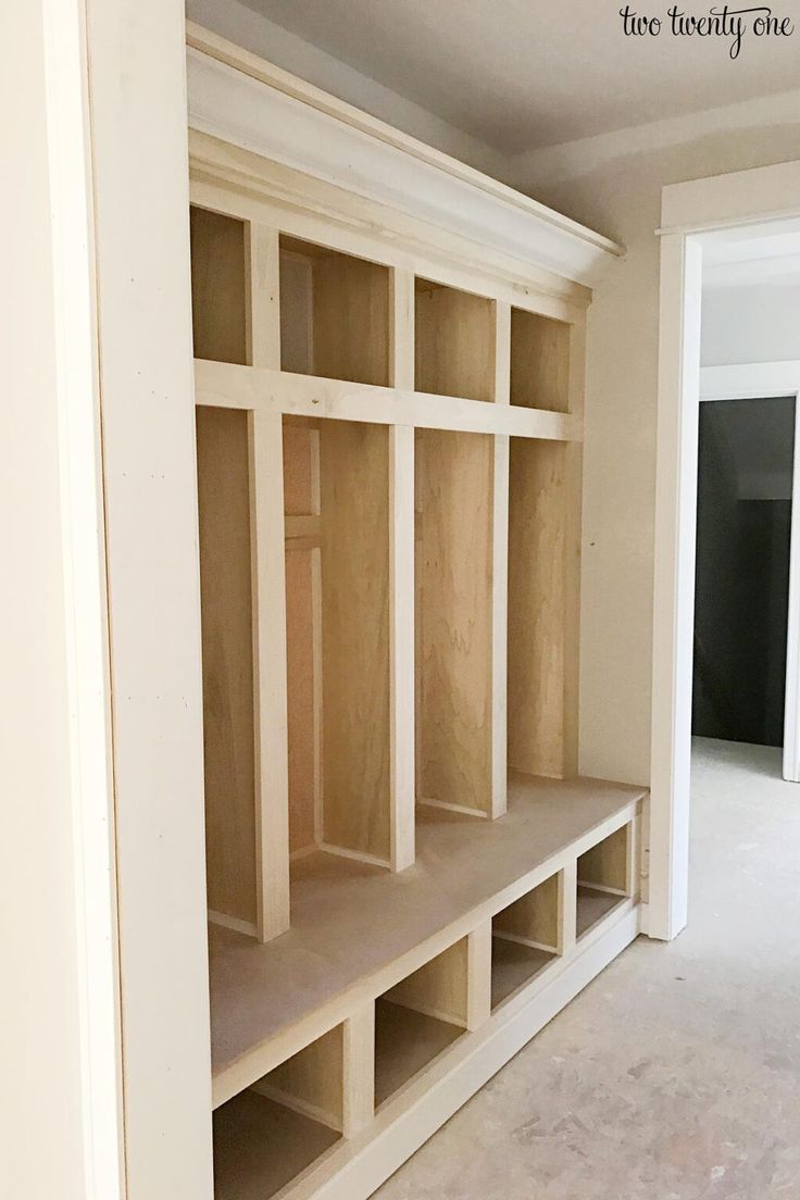 an empty room with some shelves in it