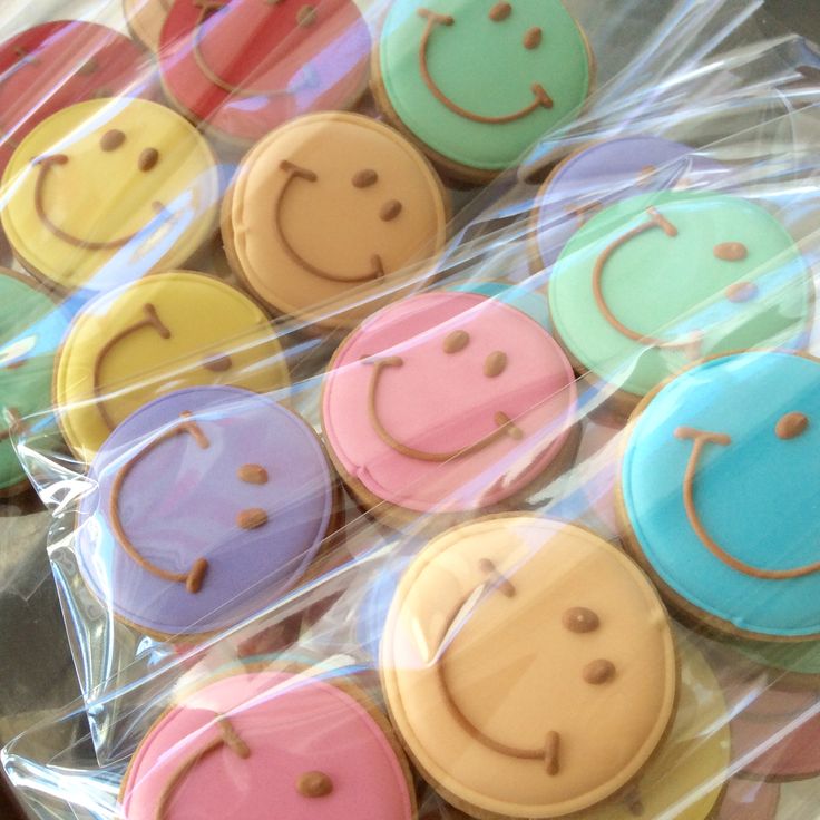 some colorful cookies with smiley faces on them