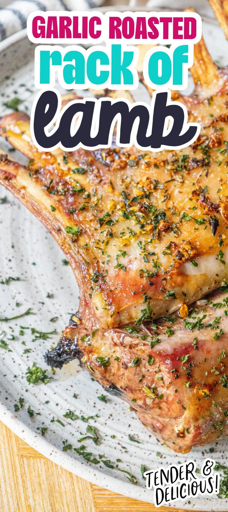 garlic roasted rack of lamb on a plate with text overlay that reads garlic roasted rack of lamb