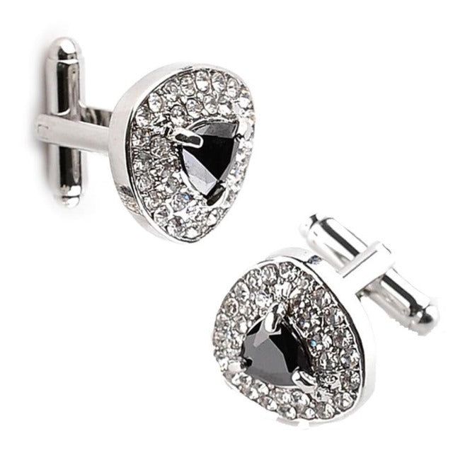 Sparkly designs that pique interest in the right way! This cufflink set is a must-have. With a gleaming color filled centerpiece surrounded by shiny crystals, each cufflink catches your attention immediately. Every facet of the crystals dazzles radiantly when light falls on them, making it hard to miss this elegant accessory for that special occasion. Specifications Metal Type: Zinc Alloy Shape\pattern: Triangle Stone Colors: Black/White/Purple Material: Metal Model Number: B1121 Metal Finish: S Classic Cuff Jewelry For Party, Formal Diamond White Jewelry With Black Diamonds, Modern Formal Jewelry With Bling, Classic Jewelry With Bling For Formal Occasions, Classic Formal Jewelry With Bling, Classic Bling Jewelry For Formal Occasions, Shiny Crystals, Pattern Triangle, Cufflink Set