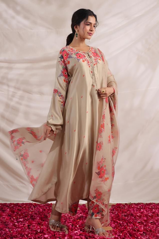 Ivory silk asymmetric kurta with side pockets, multi color placement floral print, sequin, bead and French knot thread embroidered highlights. Paired with palazzo with printed border.
Components: 2
Pattern: Printed and Hand Embroidered
Type Of Work: Bloom Print, Bead, Sequin and French Knot Thread Work
Neckline: V Neck
Sleeve Type: Puff Sleeves
Fabric: Silk
Color: Ivory
Other Details: 
Embroidered yoke
Curved hem
Side slits
Embroidered highlights
Model height: 5ft inches, wearing size S
Kurta Cl Knot Thread, Kurta With Palazzo, Kurta Palazzo Set, Beautiful Pakistani Dresses, Palazzo Set, Silk Kurta, Kurti Designs Party Wear, Kurta Designs Women, Boutique Dress Designs