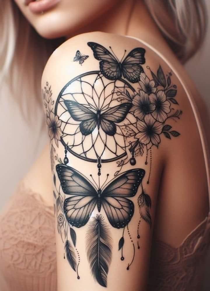 a woman's shoulder with butterflies and a dream catcher tattoo on her left arm