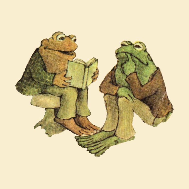 two frogs sitting next to each other reading books