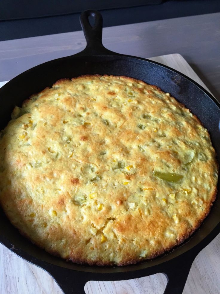 an omelet in a cast iron skillet on top of a stovetop