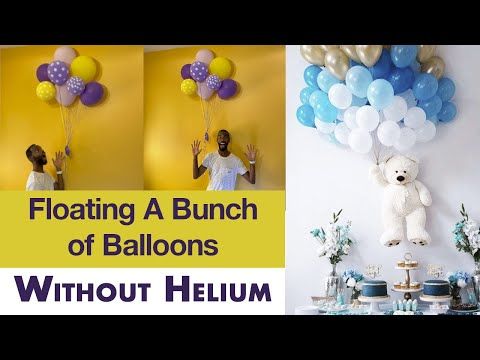 a bunch of balloons that are in the air