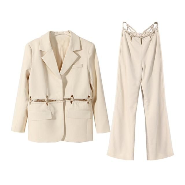 The label's impeccable tailoring shines through on the little details of this loose wide-leg suit and demonstrate that suiting doesn't need to be boring. DETAILS & CARE Side articulate stitch design Loose fit Zip fly with hook-and-bar closure 75% cotton, 25% polyester Dry clean Chic Office Wear Sets For Spring, Beige Workwear Sets For Spring, Beige Sets For Workwear In Spring, Patchwork Suit, H.e.r Style, Patchwork Trousers, Two Piece Suits, Trouser Design, Digital Closet