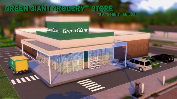 a green giant grocery store with cars parked in front and on the street next to it