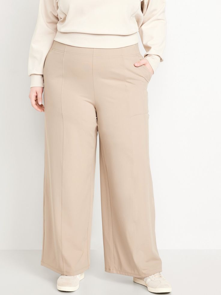 elasticized waist hip pockets seamed front leg pockets fit your phone go-dry wicks moisture pull-on style sits at belly button loose hip and thigh wide leg 30 1/2" regular inseam 28 1/2" petite inseam 33 1/2" tall inseam models are approx.  5'9" and wear sizes s (4), l (12), and xl (18)machine wash according to the care instruction label Comfort Stretch Solid Bottoms With Hip Pockets, Solid Bottoms With Hip Pockets And Comfort Stretch, Solid Color Bottoms With Comfort Stretch And Hip Pockets, Stretch Wide-leg Dress Pants With Pockets, Wide-leg Stretch Dress Pants With Pockets, Comfort Stretch Straight Leg Bottoms With Pockets, Relaxed Fit Full Length Bottoms With Wide Waistband, Stretch High Waist Wide Leg Pants With Pockets, Stretch Wide-leg Bottoms With Pockets