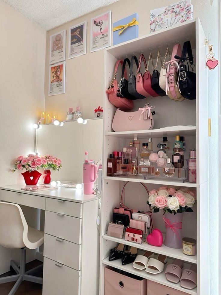 a white desk topped with lots of drawers and pink purses on top of it