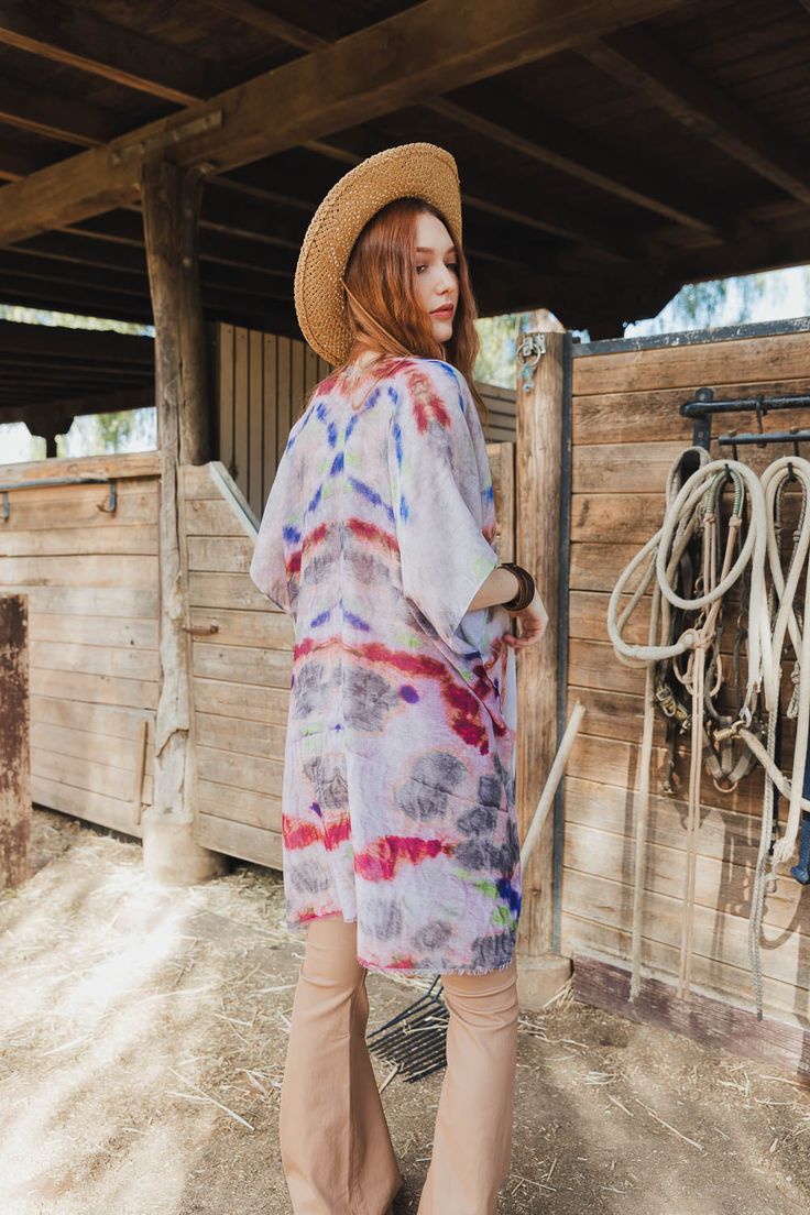 Are you looking for something special to rock at your next music festival? Look no further than the Daydream Tie Dye Cover Up! This kimono is full of stylish fun, sure to make you stand out in a crowd. You'll be the talk of the town with this pretty piece as your go-to festival must-have! #lovemyleto 100% Polyester Imported