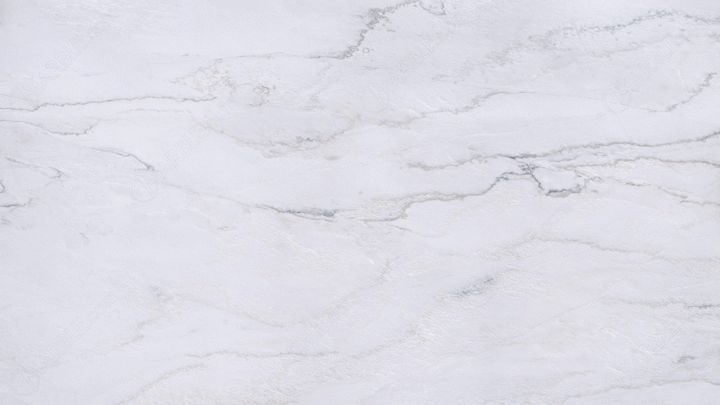 a white marble textured surface with grey streaks