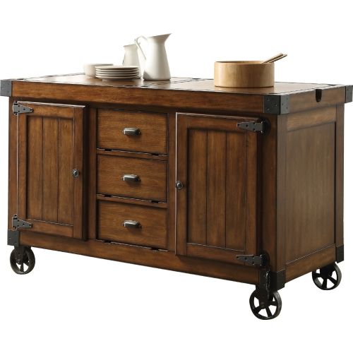 a kitchen island with drawers and plates on top