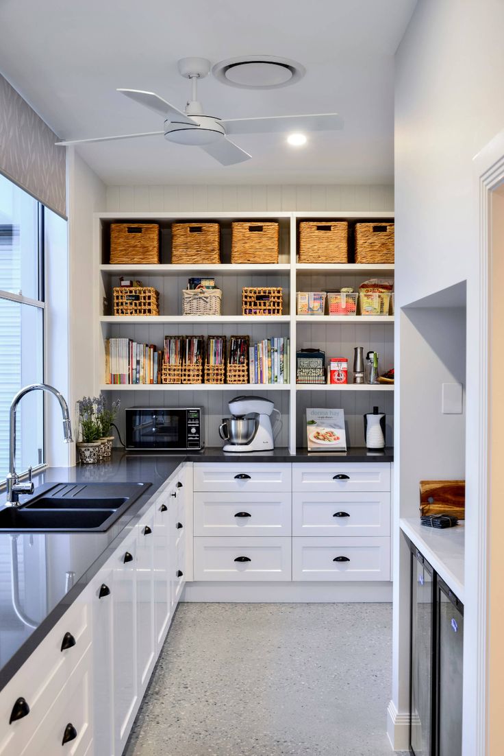 the kitchen is clean and ready for us to use it's shelves are open