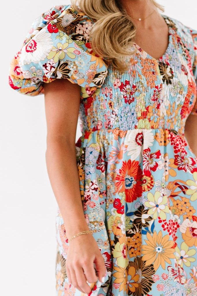 We kind of think the following……you can never have too many dresses. You can never have too much floral print. Also, we’d rather be over dressed than under dressed at any given moment, at any given event. This floral print makes us feel all sorts of happy and energetic! It’s bright and fun but not over done. The puff sleeves make us feel pretty! We love a good midi length because it works for all the bodies! The simple v neck is flattering and last but not least, the fabric is lightweight but co Spring Multicolor Floral Patchwork Maxi Dress, Multicolor Floral Patchwork Maxi Dress For Spring, Ditsy Floral Print Sundress For Brunch, Spring Floral V-neck Dress With Vibrant Print, Multicolor Floral Patchwork Dress For Garden Party, Spring Mini Dress With Vibrant Print, Spring Floral Printed Dress For Day Out, Spring Printed Dress For Garden Party, Multicolor Floral Print Midi Mini Dress