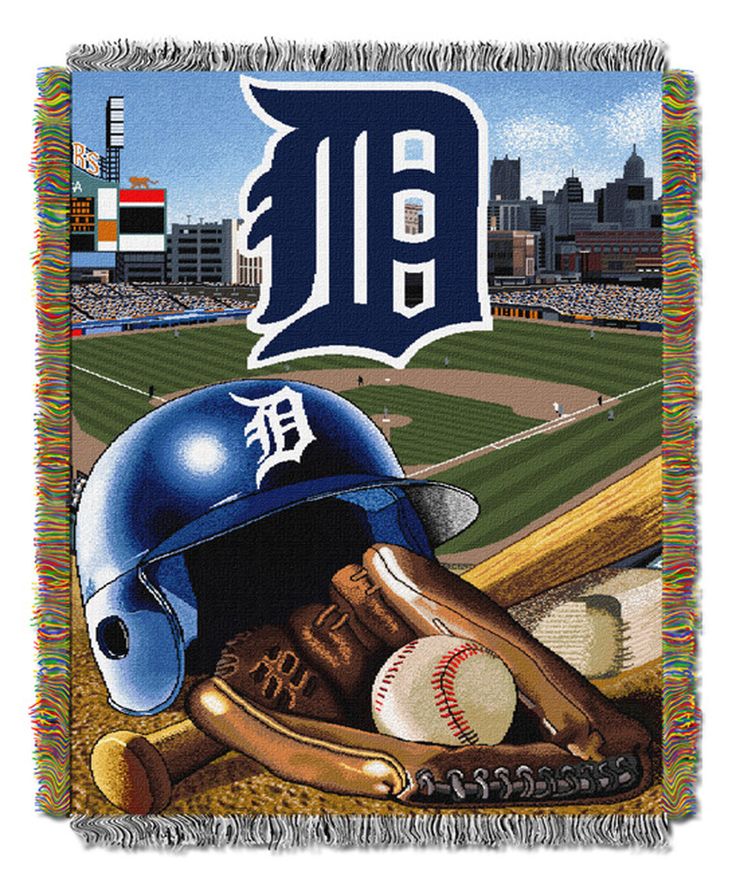 the detroit tigers throw blanket has a baseball glove, bat and ball on it in front of a stadium