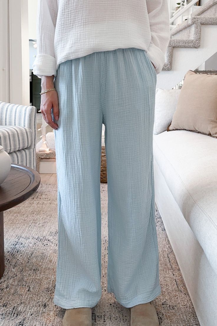 An absolutely effortless pant! The Tulum Cotton Pants in Surf Blue are made in the USA and are both lightweight and comfy. They feature an elastic waistband, side pockets, garment dyed surf blue color, soft cotton gauze fabric and a true to size fit. Style with a white tank top for a casual look! Details & Sizing Made in the USA Elastic waist Garment dyed Surf blue color Cotton gauze fabric True to size fit Gabriella is wearing a size S Fabric 100% Cotton Shipping & Returns We offer free ground Effortless Pant, Cotton Gauze Fabric, Gauze Fabric, Sweater Set, 21 Days, White Tank Top, Fit Style, Cotton Pants, White Tank