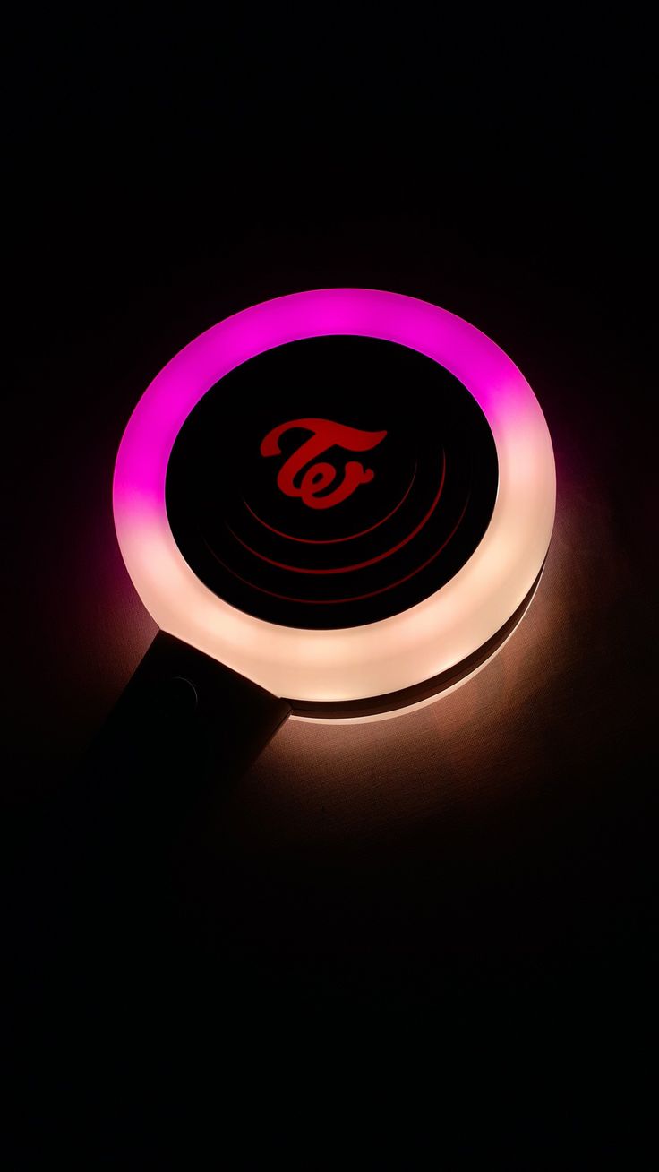 a lit up frisbee sitting on top of a table