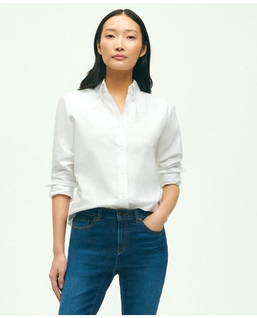 Our shirt is crafted from Oxford cotton with our signature button-down collar and 6-Pleat Shirring® at the cuff, for a nod to timeless American style. Classic silhouette that is straight in the bodyEmbroidered logo at chest100% CottonMachine washImported | Women's Classic-Fit Cotton Oxford Shirt | White | Size 2 Classic Shirt With Spread Collar For Everyday, Classic Everyday Shirt With Spread Collar, Classic Shirt With Shirttail Hem And Placket, Classic Shirt With Shirttail Hem For Everyday, Classic Everyday Tops, Classic Button-up Shirt For Everyday, Classic Button-up Shirt For Daywear, Classic Button-up Tops For Everyday, Classic Everyday Button-up Dress Shirt