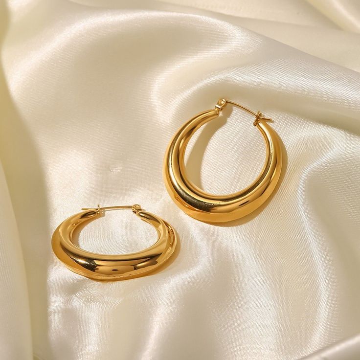 Make a bold fashion statement with Chunky Gold Hoops, flawlessly crafted in 18k gold plating. These striking earrings feature a robust and stylish hoop design, perfect for adding a touch of bold elegance to any look. Chic Chunky Hoop Jewelry, Elegant Chunky Earrings For Gift, Trendy Chunky Gold Earrings, Elegant Chunky Hoop Earrings As Gift, Elegant Chunky Hoop Earrings For Gift, Elegant Chunky Earrings For Everyday, Gold Chunky Round Earrings, Gold Chunky Hoop Earrings Trendy Style, Trendy Chunky Gold Hoop Earrings