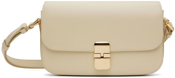 Buffed leather shoulder bag in off-white. �· Adjustable shoulder strap converts to crossbody strap · Logo stamp at back face · Tab-slot flap · Patch pocket at interior · Cotton canvas lining · H6 x W9.5 x D1.75 Supplier color: Cream Baguette Bag, Logo Stamp, A P, Patch Pocket, Leather Shoulder Bag, Cotton Canvas, Shoulder Strap, Off White, Shoulder Bag