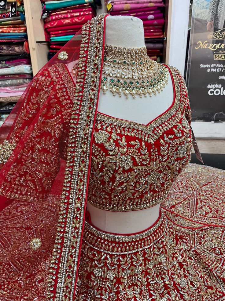 red bridal lehenga with gold work