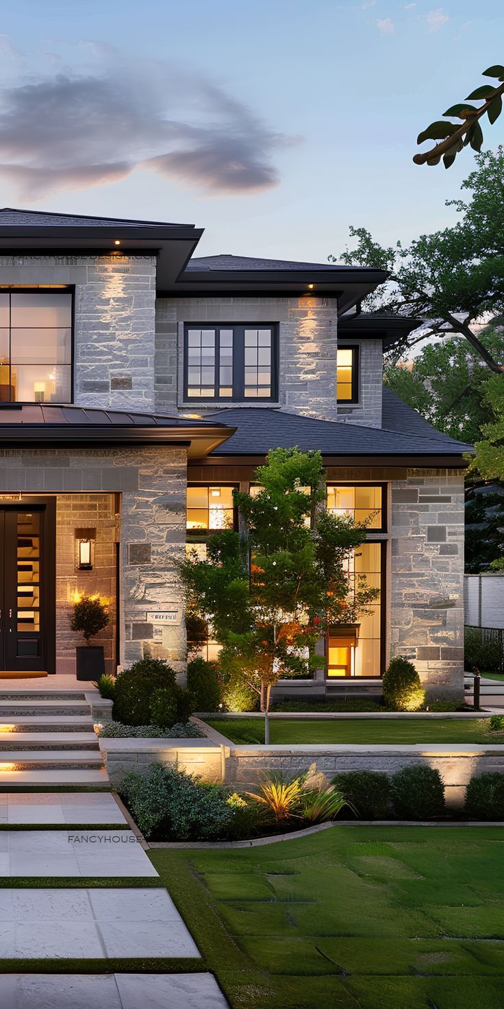 a modern house with steps leading to the front door