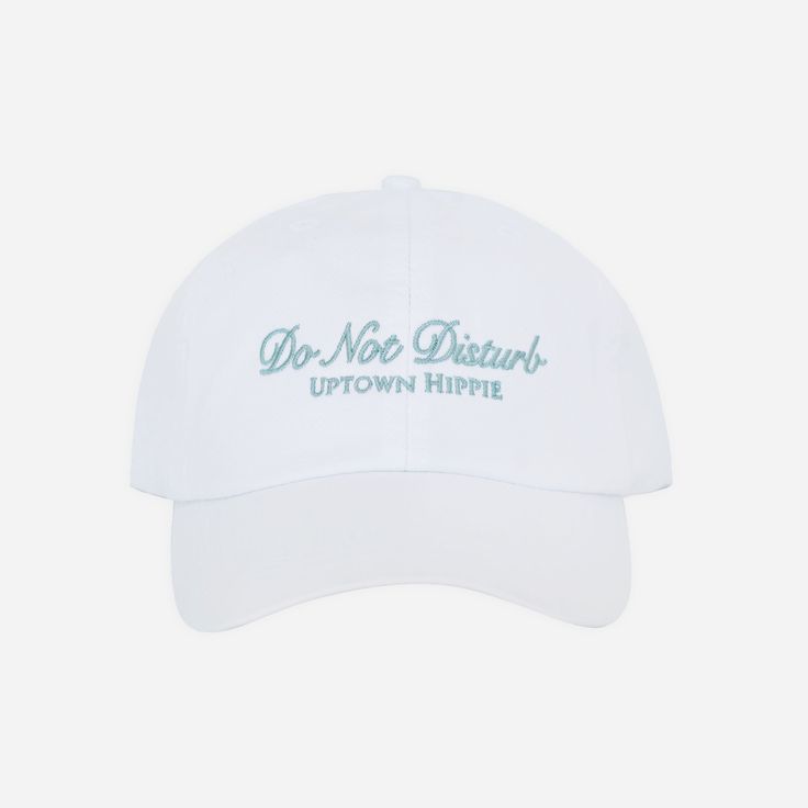 a white baseball cap with the words, dr noe detroit on it in green lettering