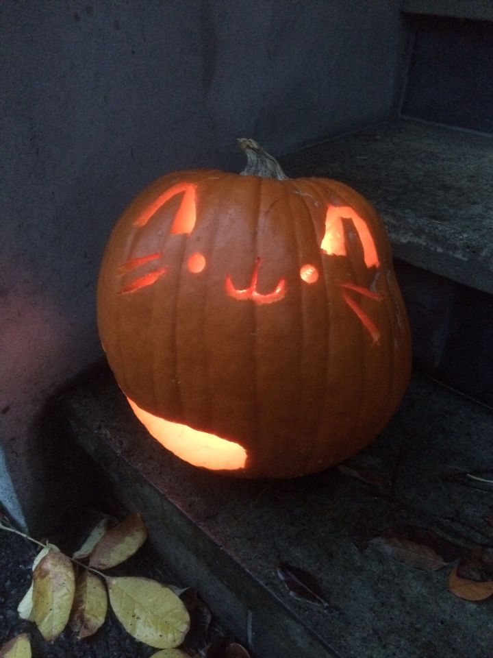 a carved pumpkin with an evil face on it