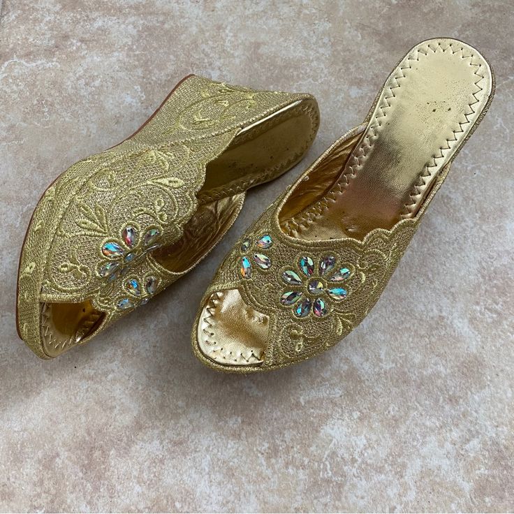 In New Condition, Never Worn. Handmade By Moroccan Artisans With Intricate Details, These Unique And Gorgeous Sandals Will Definitely Make A Statement And Are Eye-Catching While Comfortable. Featuring Leather Soles, Wedge Heel, Brilliant Gold Embroidered And Embellished With Iridescent Rhinestones And Textured Floral Patterns. Fits Us Size 7.5-8, See Pictures For Measurements Perfect To Add A Touch Of Glamour To Any Outfit Or For Weddings And Other Special Occasions. Brand New, Never Worn But Ha Gold Embellished Wedge Sandals With Round Toe, Summer Embroidered Wedge Heel Sandals, Gold Embellished Open Toe Wedge Sandals, Gold Open Toe Wedge Sandals For Wedding, Festive Heels For Spring, Gold Wedge Sandals For Summer Wedding, Gold Wedge Heel Sandals For Wedding, Gold Wedge Sandals For Wedding, Festive Evening Open Toe Sandals