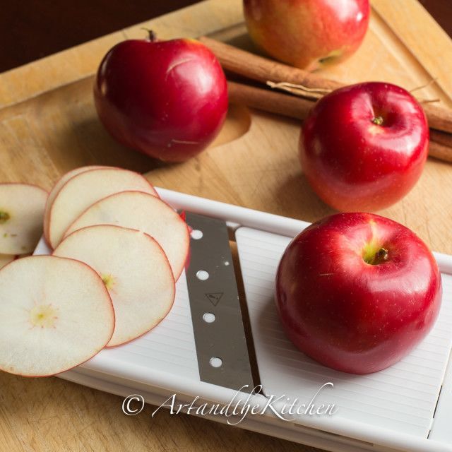 some apples are on a cutting board with a knife