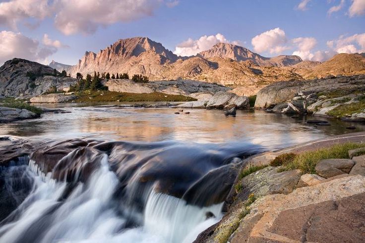 a river running through a rocky mountain valley