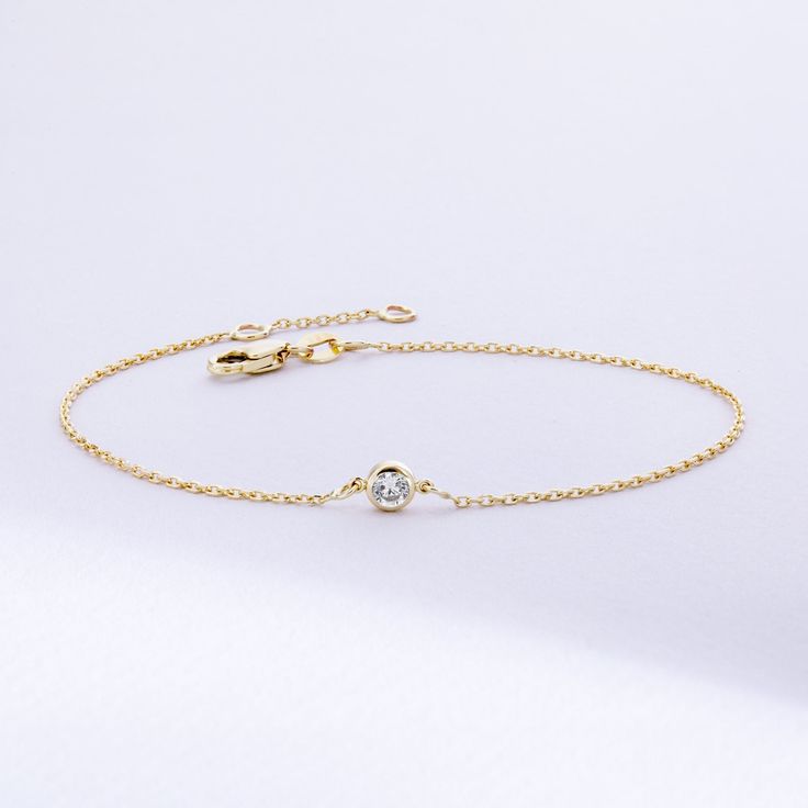 Solitaire Diamond Bracelet in 14K or 18K solid Gold, Bezel Set Dainty Diamond by the Yard Bracelet, Minimalist Bracelet Gift for Women, Graduation Gifts, Gift For Valentine, Gift For Birthday, Gift For Bridesmaid, Wedding Gift For Her ► Adding a customized tiny bar at clasp may be a good idea: https://etsy.me/3cn9OQ5 Material: Solid Gold, real gold (not gold plated or gold filled material) Karat: 14K (585), 18K (750) Gemstone: Genuine Diamond Available diamond options (size mm - weight ct): 1.80 Elegant Yellow Gold Bracelet With Bezel Setting, Formal 14k Gold Bracelets With Bezel Setting, Elegant 14k Gold Chain Bracelet With Bezel Setting, Elegant 14k Gold Bracelet With Birthstone, Yellow Gold Bracelet With Bezel Setting, 14k Gold Bracelet With Bezel Setting, Classic 14k Gold Bracelets With Bezel Setting, Timeless 14k Gold Bracelets With Bezel Setting, Timeless 14k Gold Bracelet With Bezel Setting