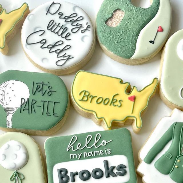 decorated cookies are arranged in the shape of golf related items