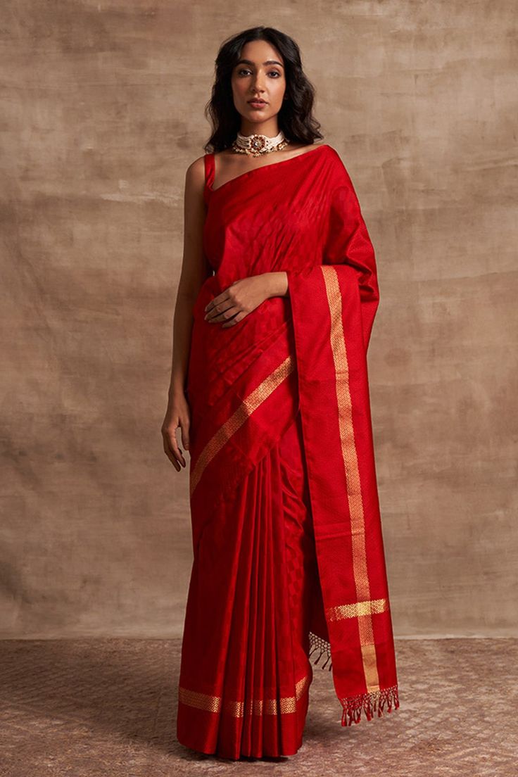 Red Banarasi handloom saree with woven geometric pattern border, self-checkered design and fringe border.
Components:1

Fabric:Base Fabric Pure Silk
Color:Red
Kadhua crafted
Note: Blouse worn by the model is not for sale - Aza Fashions Red Tussar Silk Pre-draped Saree For Festivals, Pre-draped Cutdana Saree For Rituals, Cotton Silk Traditional Wear For Rituals, Pre-draped Saree For Diwali Rituals, Art Silk Saree For Rituals, Festive Cotton Silk Traditional Wear For Rituals, Festive Slub Silk Traditional Wear For Rituals, Art Silk Pre-draped Saree For Rituals, Elegant Saree For Navratri Rituals