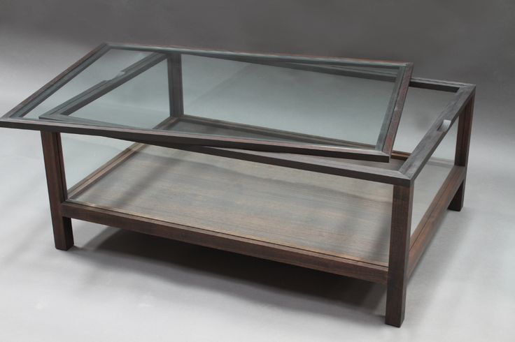 a glass and wood coffee table with shelves