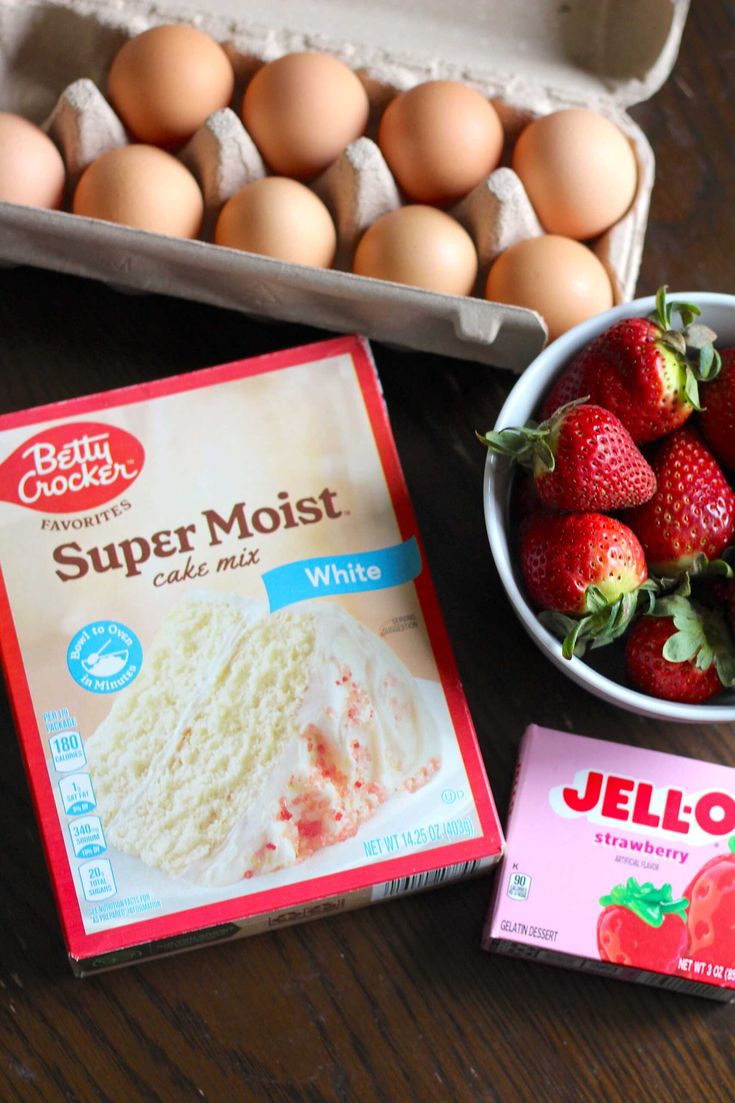 eggs, strawberries and cake mix are on the table