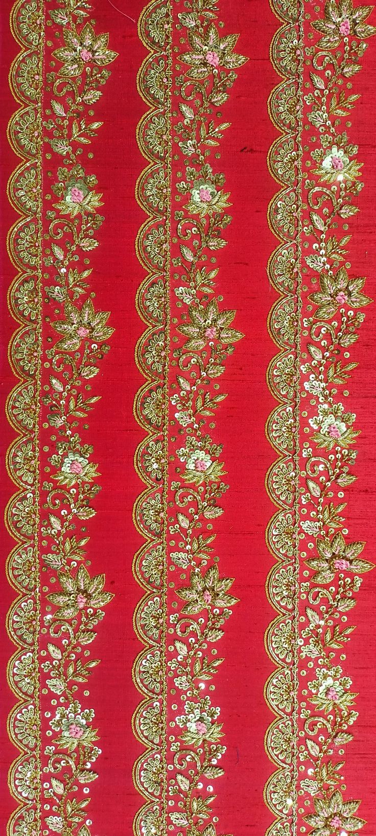 a red and gold wallpaper with flowers on it