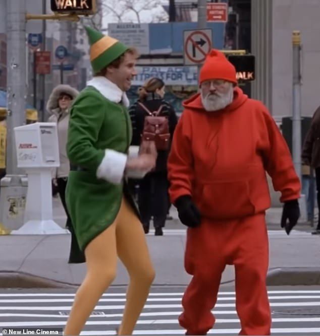 two people in costumes are walking across the street with one person dressed as an elf