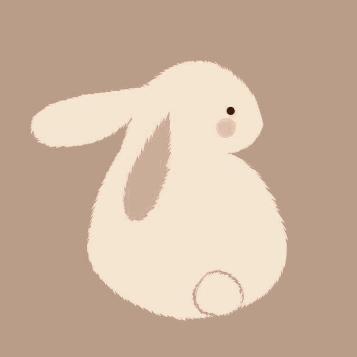 a white rabbit sitting on top of a brown background