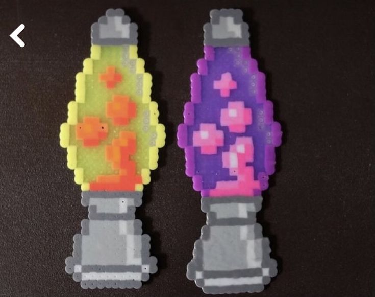 two pieces of pixel art made to look like toothbrushes with different colors and shapes