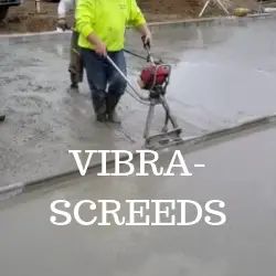 a man in yellow shirt using a machine on concrete