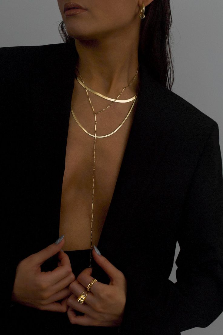 A lightweight showpiece, the Cressida 14K Gold-filled Y necklace, was designed to effortlessly move with you. The elongated flat bars reflect on the skin, creating a subtle yet lustrous glow. Crafted with a dramatic elongated drop, to perfectly accent v necklines or swimsuits, an alluring combination of necklace and body chain.Material: 14K Gold-filled Dimension: 16.5 to 19 inches adjustable, 12.5 inch drop, 2mm chain width What is 14K Gold-filled? A thick gold layer (100 times more gold than go Jewelry Capsule, Modern Gold Jewelry, Jewelry Wardrobe, Lana Jewelry, Necklace Collection, Y Necklace, Coin Pearls, Jewelry Essentials, Demi Fine Jewelry