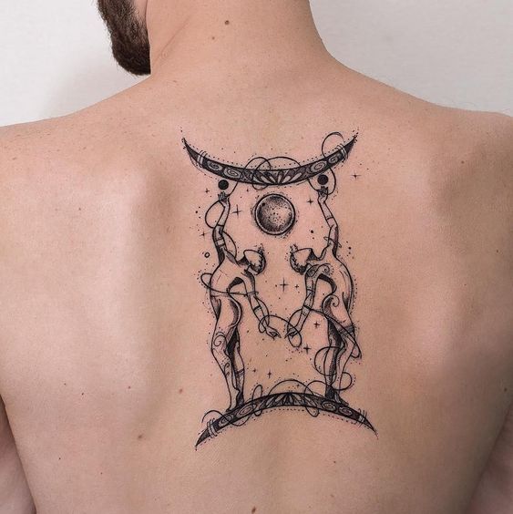 a man with a tattoo on his back