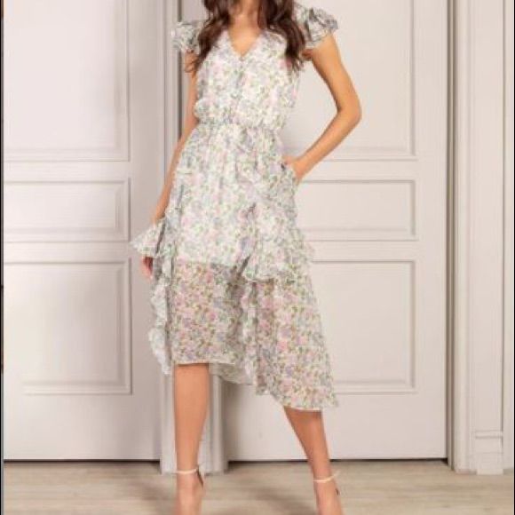 New With Tags Romantic Ruffle Midi Dress 100% Polyester Elegant V-neck Ruffle Dress With Floral Print, Feminine V-neck Ruffle Dress For Garden Party, Flowy V-neck Ruffle Dress For Garden Party, Spring Flowy Ruffle Dress For Casual Occasions, Feminine Spring Midi Dress With Ruffle Hem, Spring Casual Flowy Ruffle Dress, Flowy Ruffle Dress For Casual Spring Wear, Elegant Floral Print V-neck Ruffle Dress, Feminine Midi Dress With Ruffle Hem For Garden Party