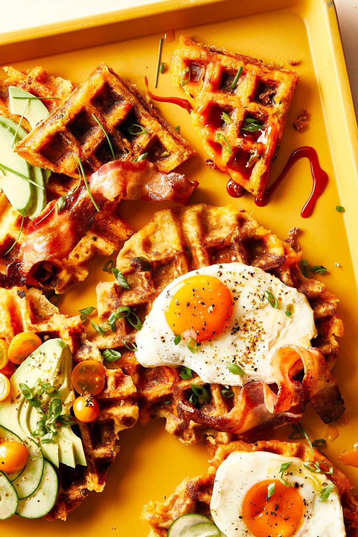 some waffles and eggs on a yellow tray with the words, leftover mashed potato waffles